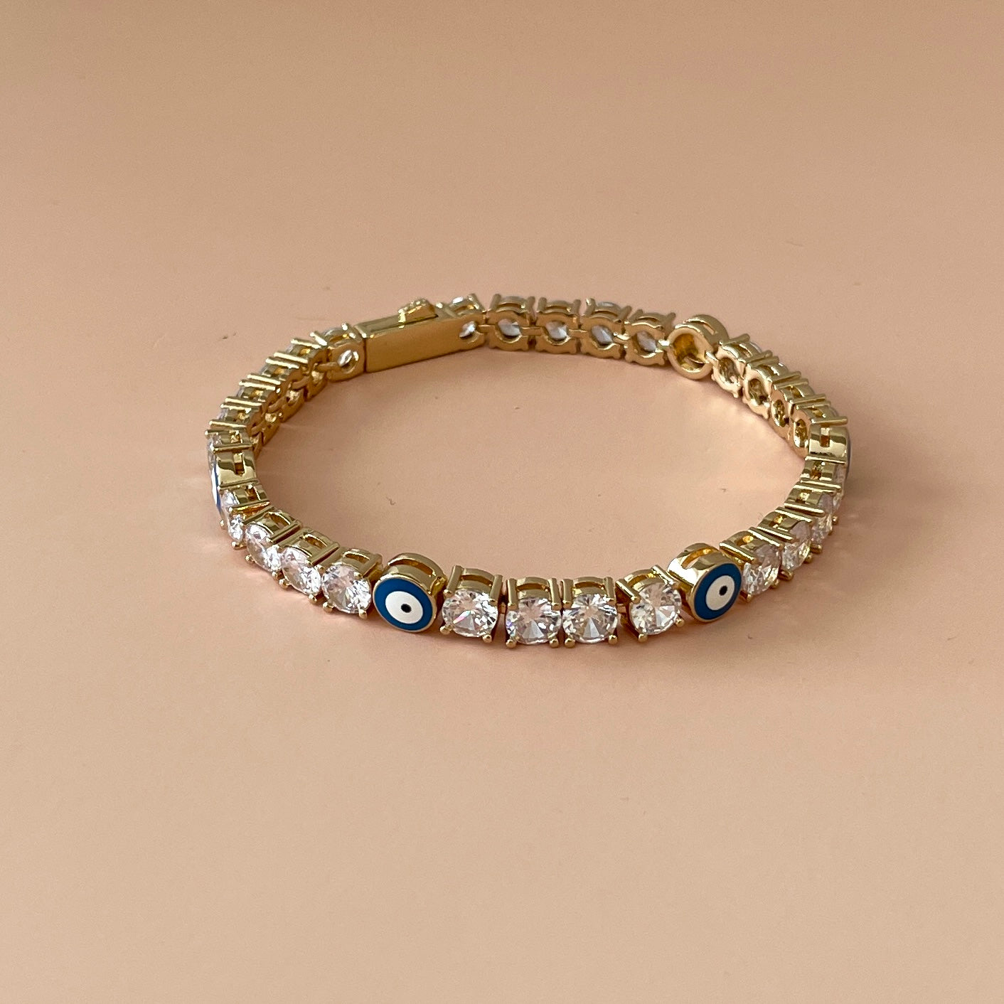 PULSERA TENNIS CON OJO AZUL GOLD