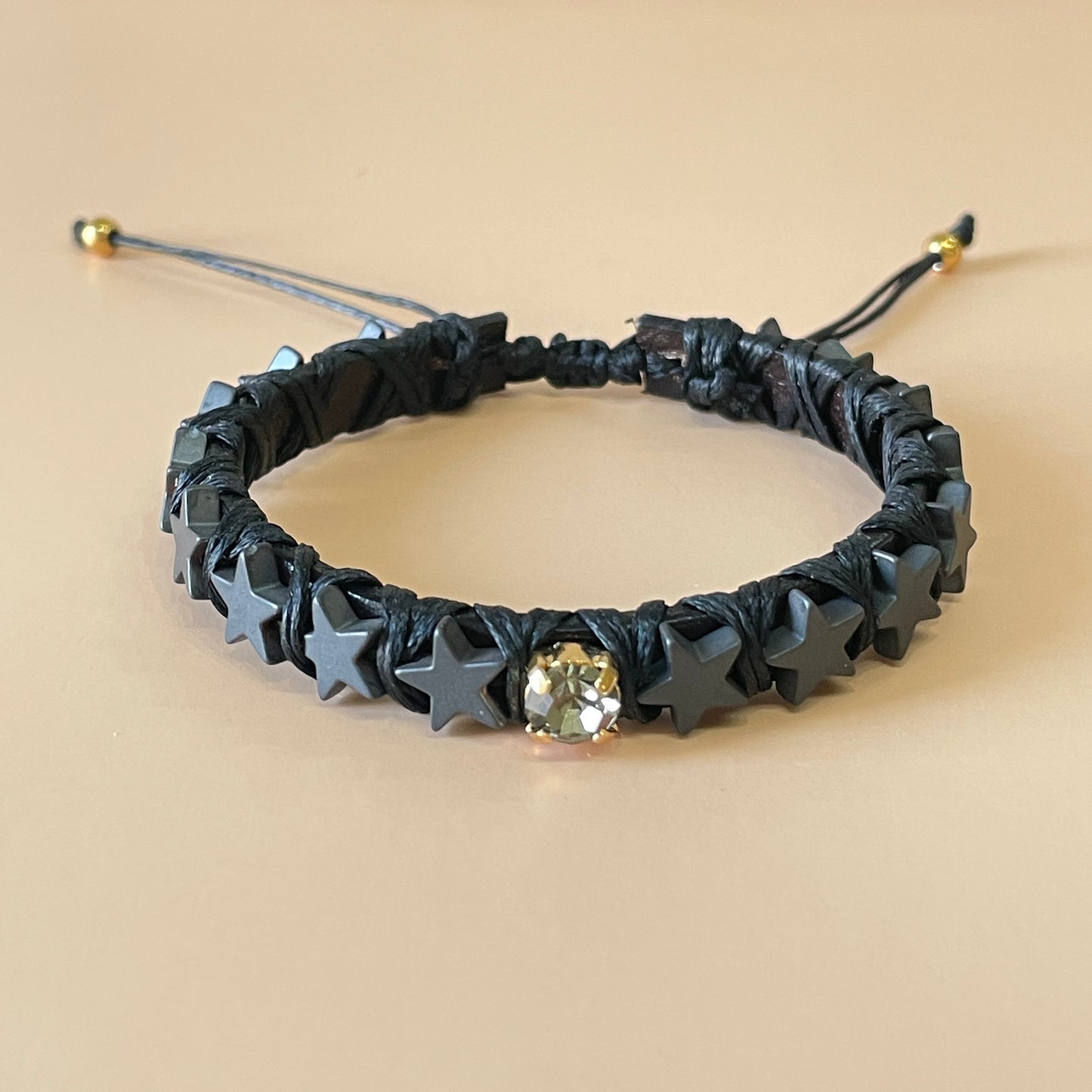 PULSERA FAVORITA ESTRELLAS NEGRAS CRISTAL GRIS -HN