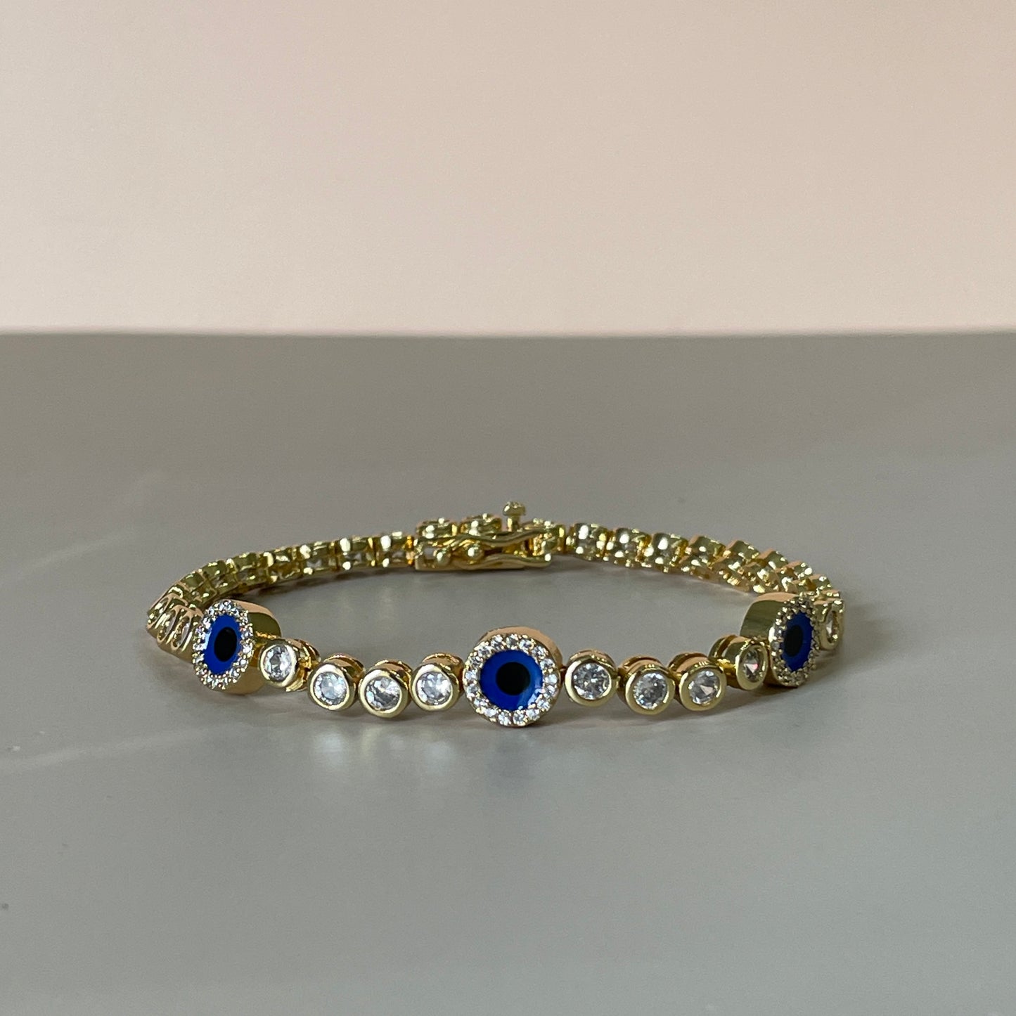 PULSERA BOLITAS CRISTAL CON TRES OJITOS