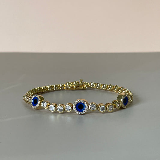 PULSERA BOLITAS CRISTAL CON TRES OJITOS