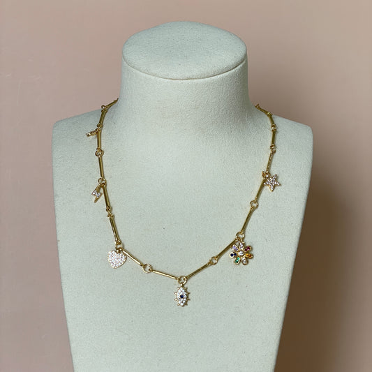 COLLAR PIRITAS CON CHARMS FLOR Y ESTRELLAS