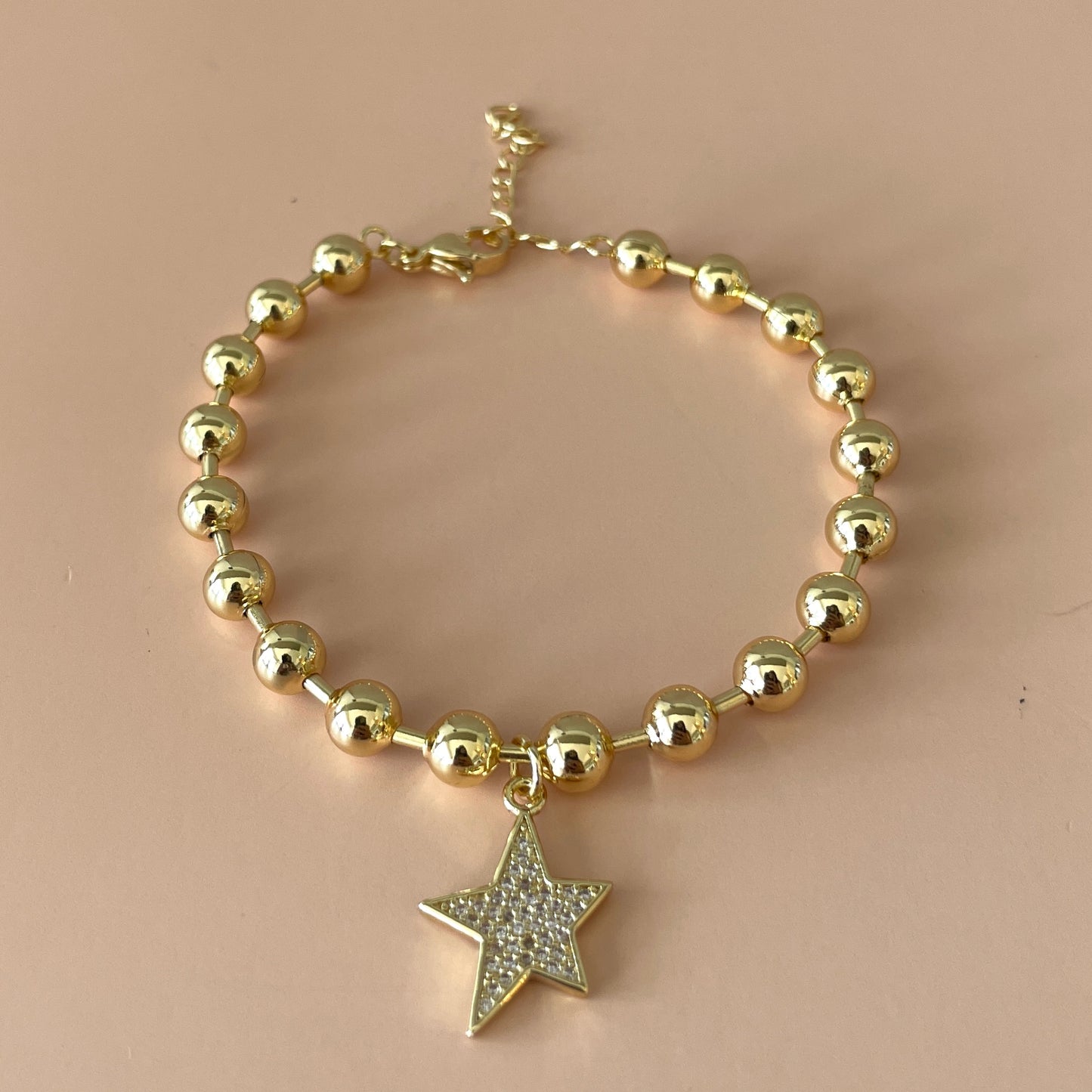 PULSERA BOLITAS GOLD Y ESTRELLA