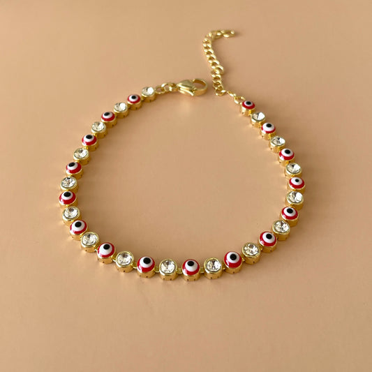 PULSERA TENNIS GOLD OJO ROJO