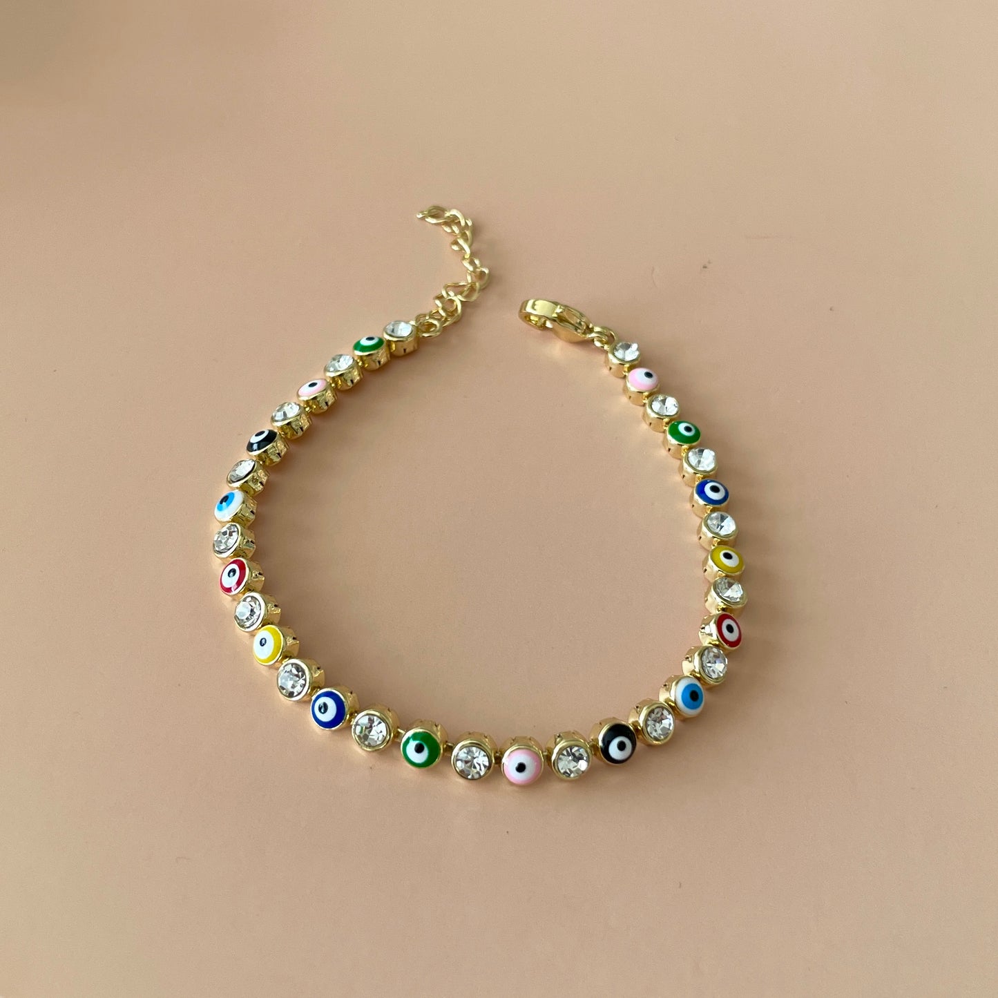 PULSERA TENNIS GOLD OJO COLORFULL