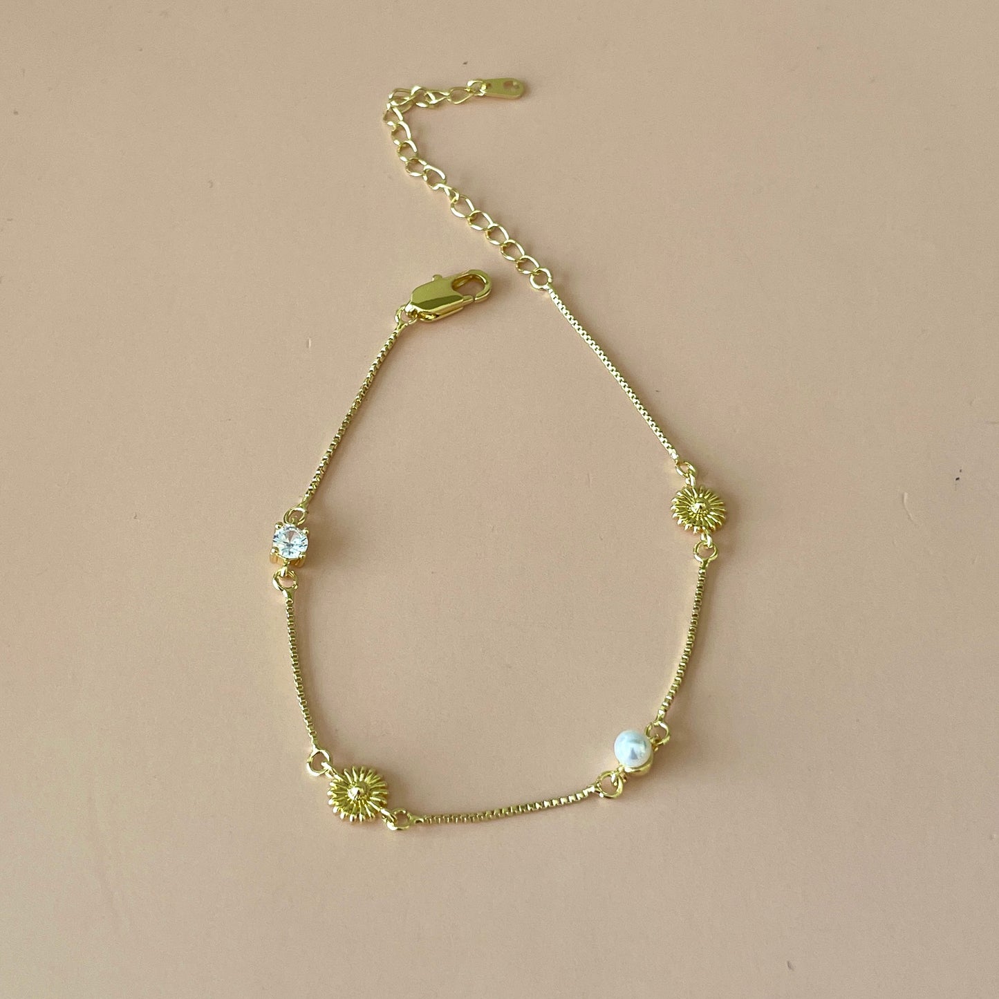 PULSERA FLOR GIRASOL Y PERLAS