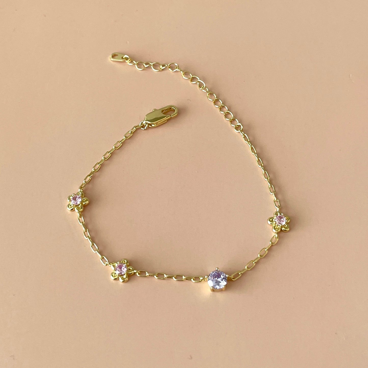PULSERA FLOR ROSA -MORADO