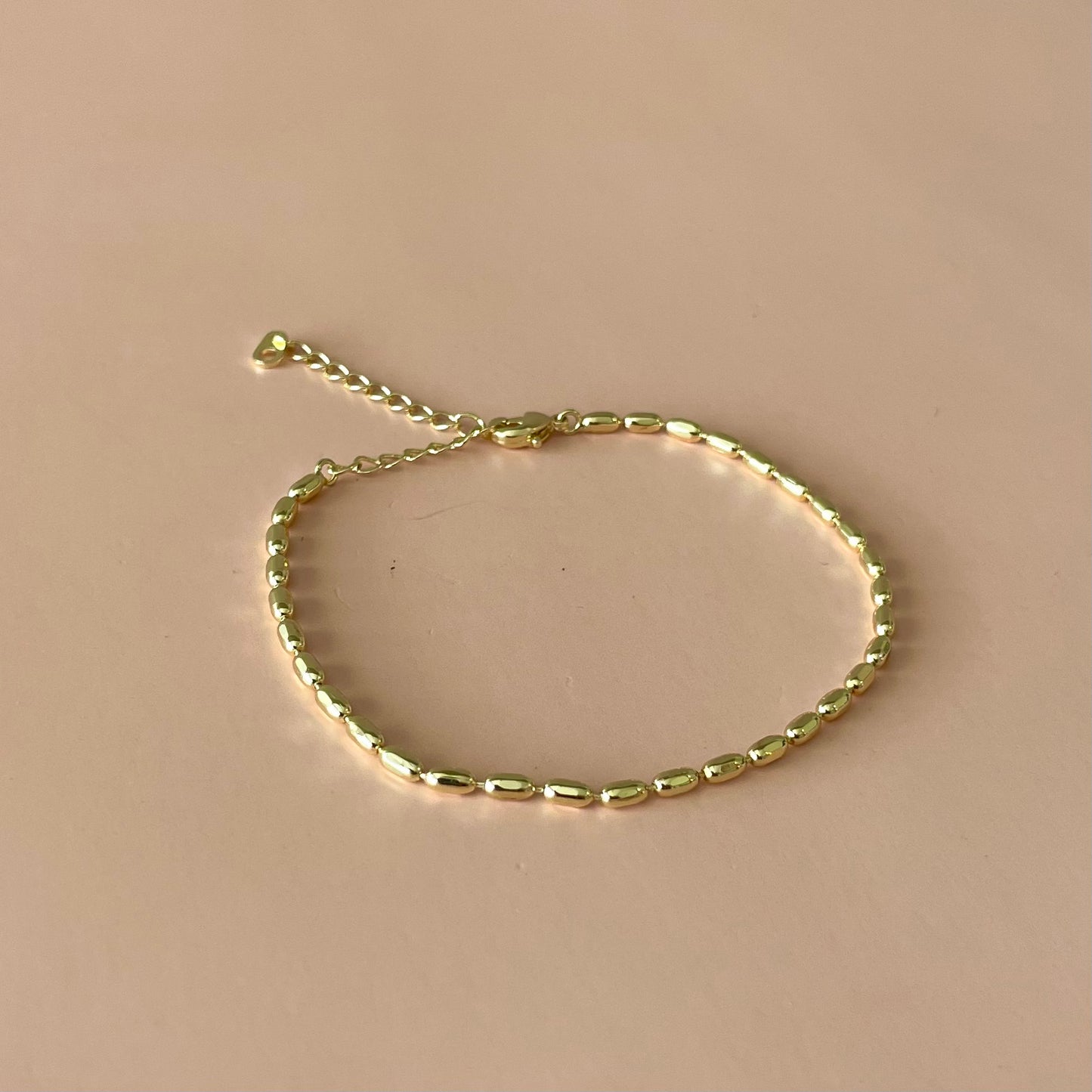 PULSERA BOLITAS ALARGADAS GOLD