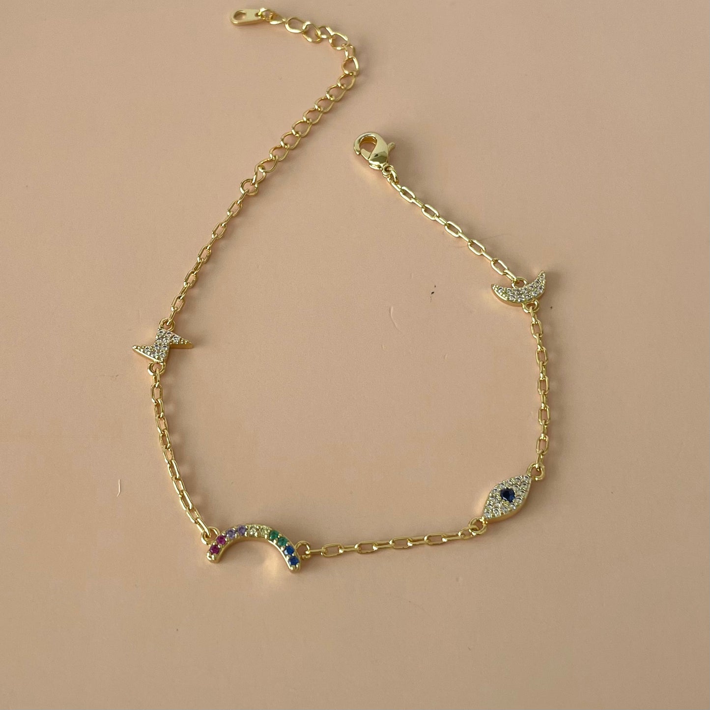 PULSERA GOLD CHARMS DE OJITO Y RAYO