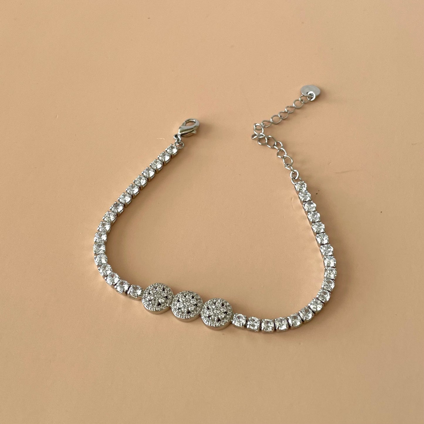 PULSERA TENNIS SILVER CON TRES FLORES CIRCULAR