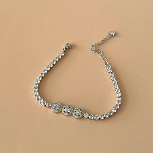 PULSERA TENNIS SILVER CON TRES FLORES CIRCULAR