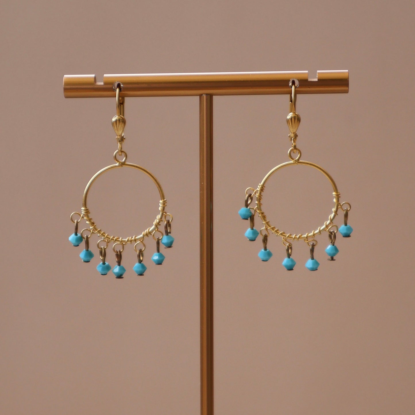 ARETES CIRCULAR CON CRISTALES COLGANTES TURQUESA