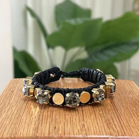 PULSERA CLEO CRISTAL GRIS CON MONEDA LISA